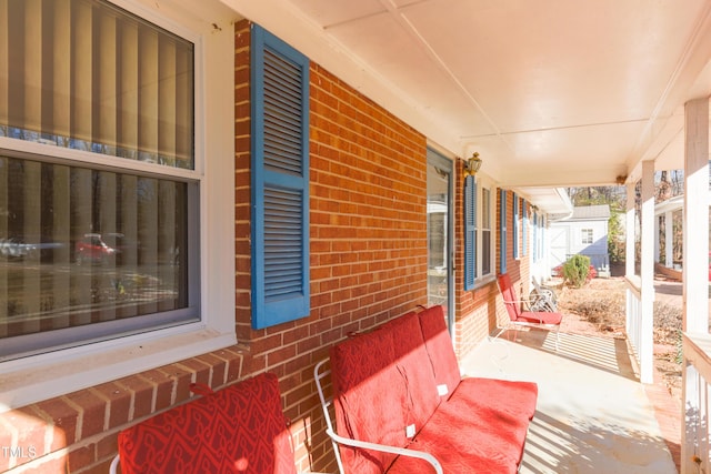 view of patio featuring a porch