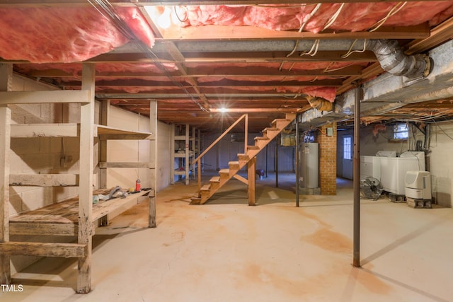 basement with washing machine and clothes dryer and gas water heater