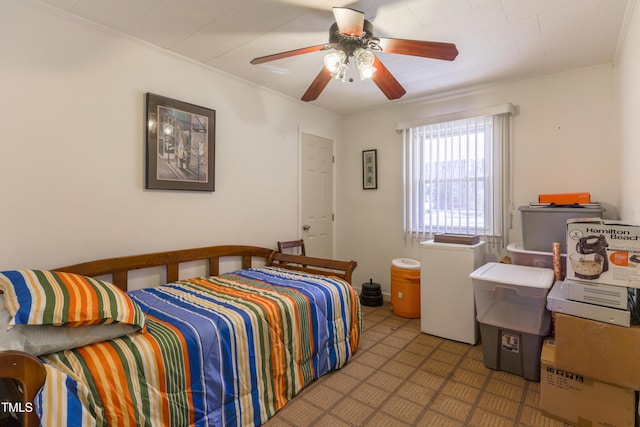 bedroom featuring ceiling fan and refrigerator