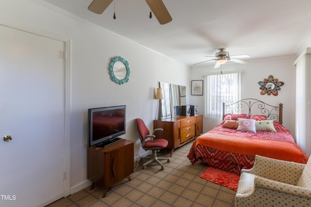 bedroom with ceiling fan and crown molding