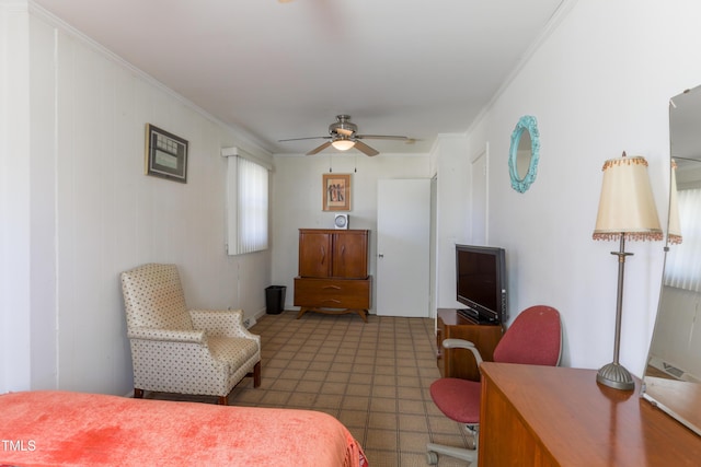 interior space with ceiling fan and ornamental molding