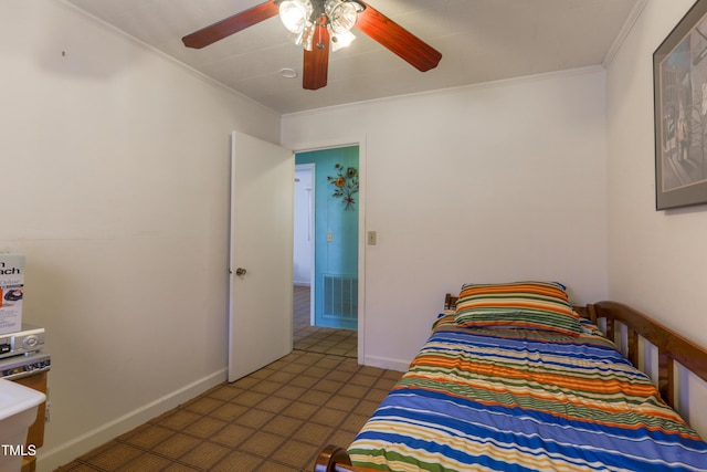 bedroom with ceiling fan and crown molding