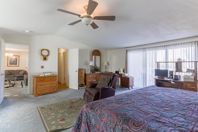 carpeted bedroom featuring a textured ceiling, ceiling fan, and lofted ceiling