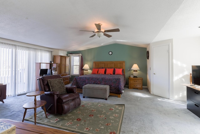 bedroom with ceiling fan, light carpet, and vaulted ceiling