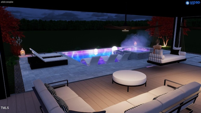 pool at night with a patio, an outdoor pool, and a hot tub