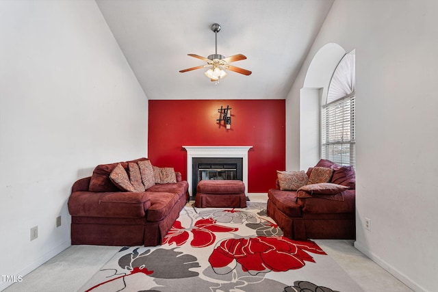 living room with light carpet, vaulted ceiling, and ceiling fan