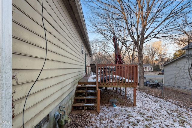 yard layered in snow featuring a wooden deck