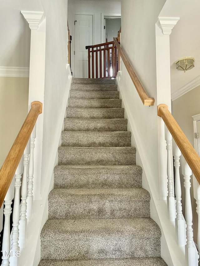 stairs featuring ornamental molding