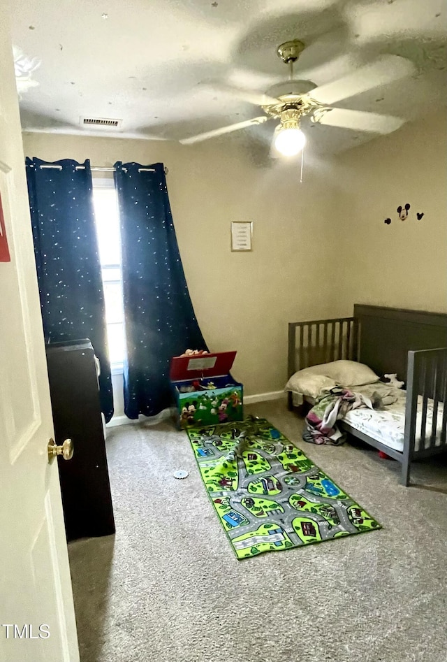 bedroom featuring carpet floors and ceiling fan