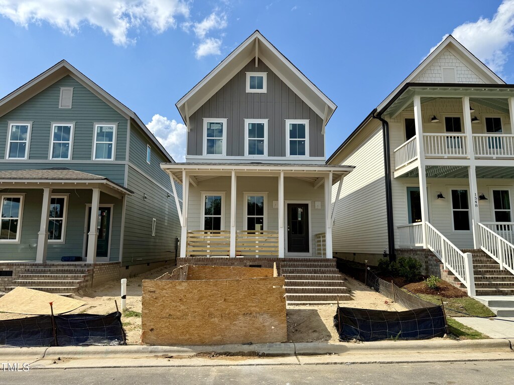 1552 Piney Falls Dr, Wendell, NC 27591 - view of front of house featuring a porch and board and batten siding