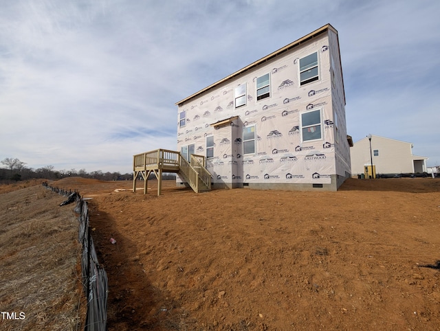 view of side of home featuring a deck