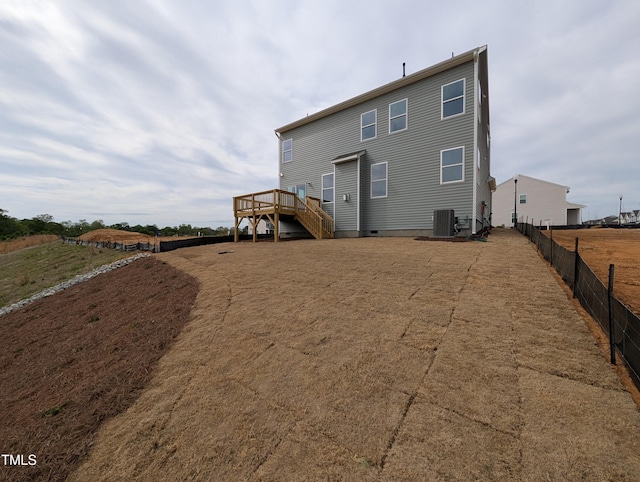 19 Grassland Dr, Garner, NC 27529 - back of property featuring central air condition unit, stairs, a wooden deck, and fence