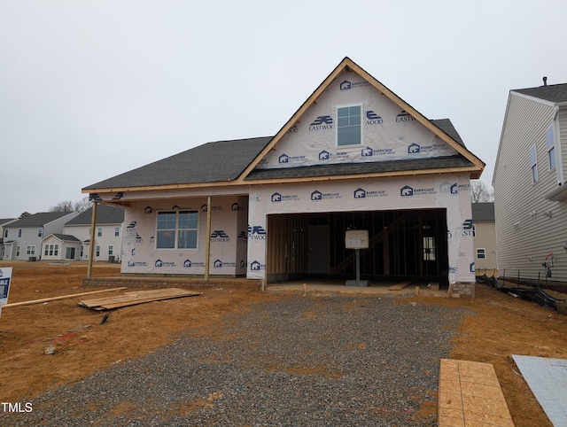 property in mid-construction with a garage and a porch