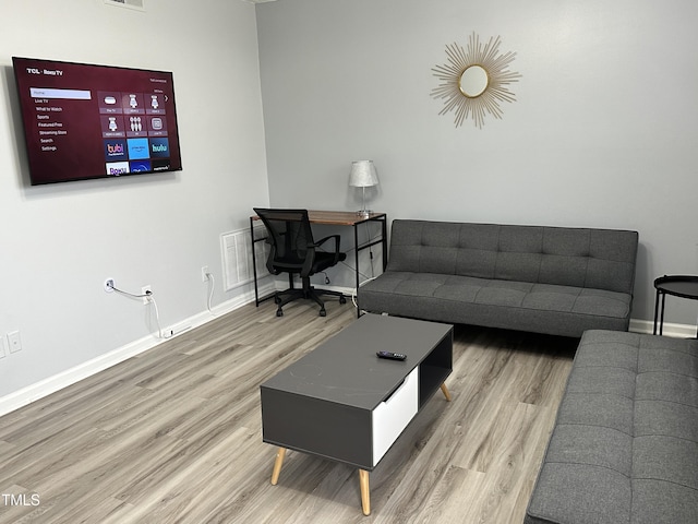 living room with hardwood / wood-style floors