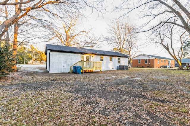 rear view of property featuring central air condition unit