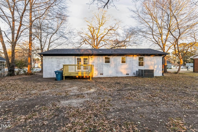 back of property with a deck and central air condition unit