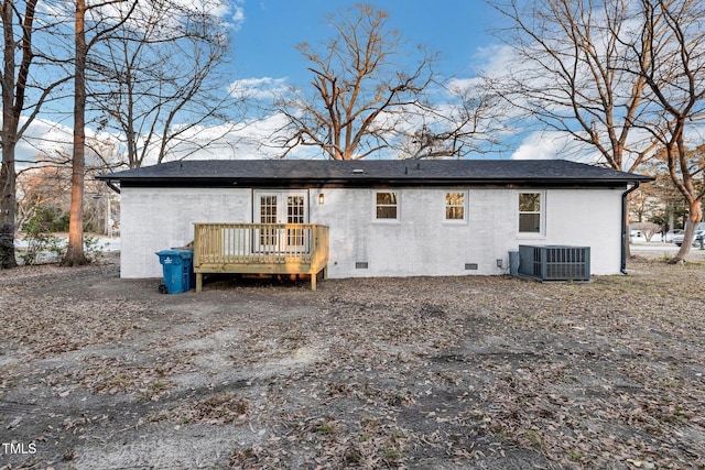 rear view of house featuring central AC unit, french doors, and a deck