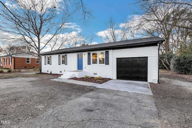 ranch-style house featuring a garage