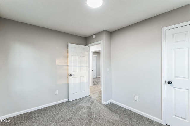 unfurnished bedroom featuring carpet flooring