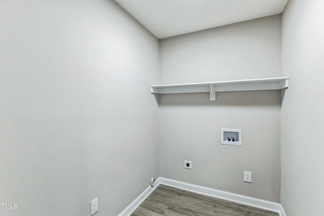 washroom featuring dark wood-type flooring, washer hookup, and hookup for an electric dryer