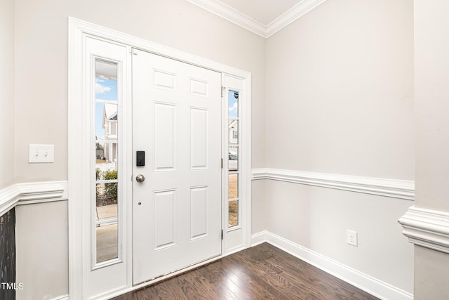 entrance foyer with dark wood-type flooring and ornamental molding