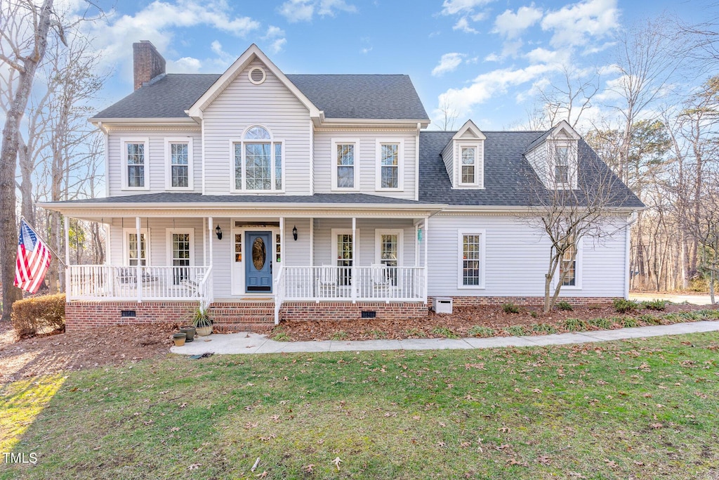 view of front of house featuring a front lawn and a porch