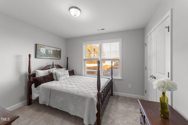 bedroom featuring light colored carpet