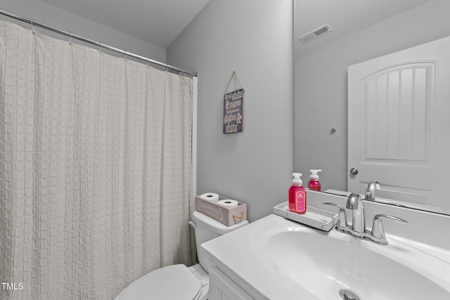 bathroom with toilet and vanity