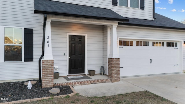 entrance to property featuring a garage