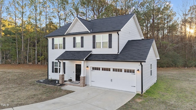 view of front facade with a front lawn and a garage