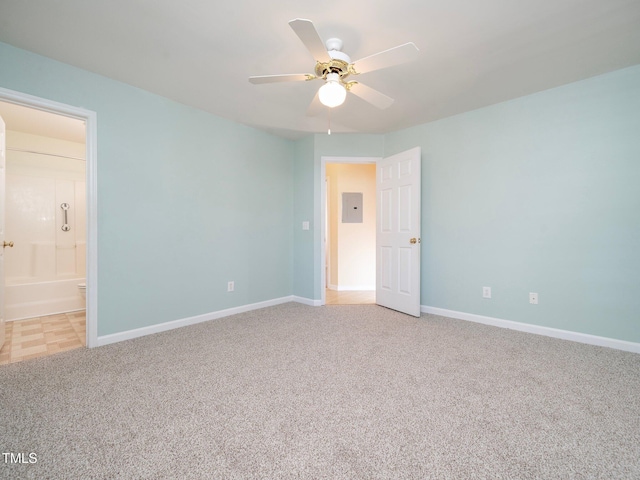 unfurnished room featuring ceiling fan, electric panel, and light carpet