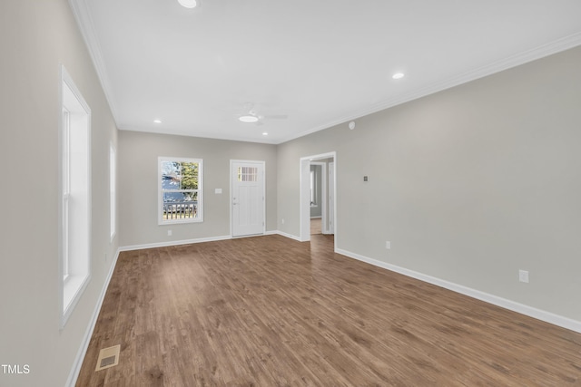 unfurnished room with ornamental molding, ceiling fan, and hardwood / wood-style floors