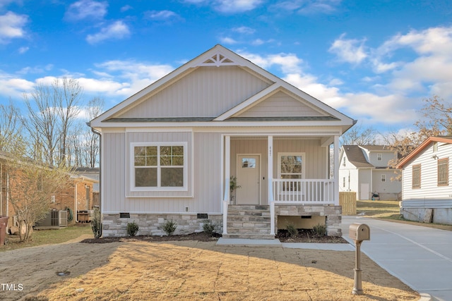 view of front of home featuring a porch and central AC