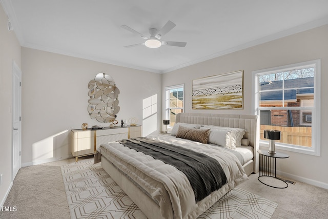 bedroom featuring crown molding, light colored carpet, and ceiling fan