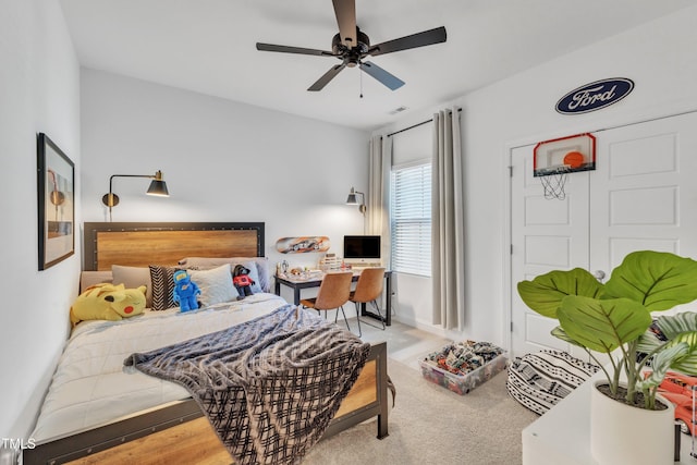 carpeted bedroom with ceiling fan