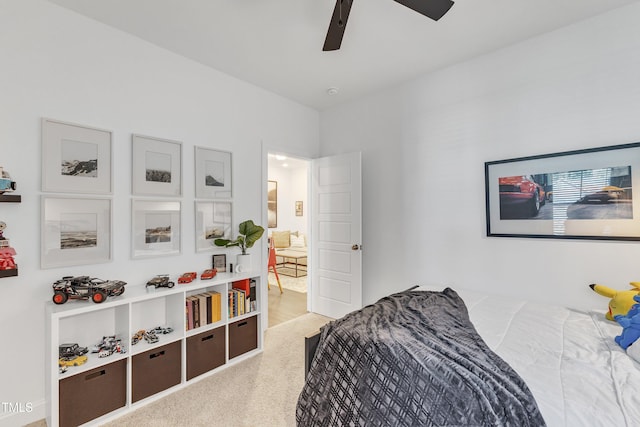 bedroom with light carpet and ceiling fan