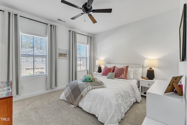 carpeted bedroom featuring ceiling fan