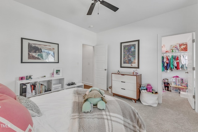 carpeted bedroom featuring ceiling fan and a closet