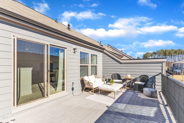 wooden terrace featuring outdoor lounge area