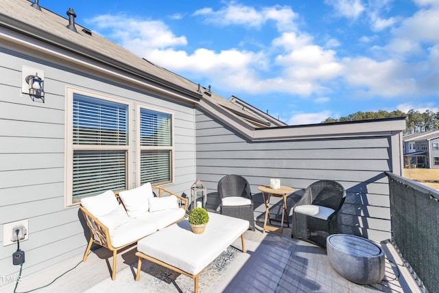 wooden deck featuring an outdoor hangout area