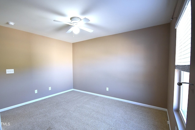 carpeted empty room with ceiling fan