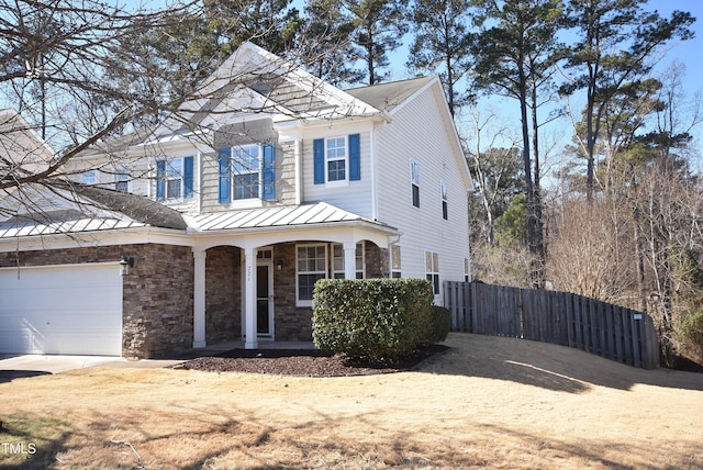 front facade with a garage and a porch