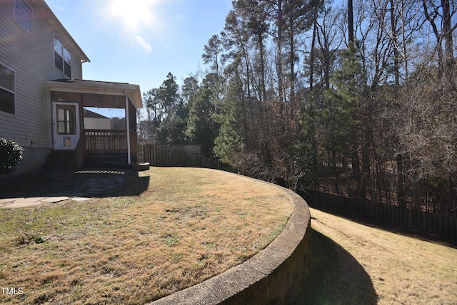 view of yard featuring a sunroom