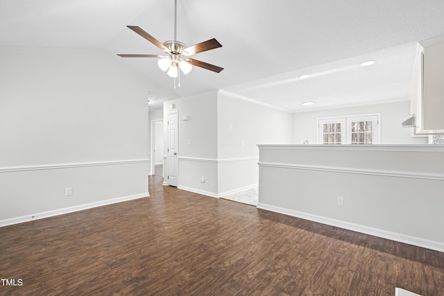 spare room featuring ceiling fan, dark hardwood / wood-style flooring, and lofted ceiling