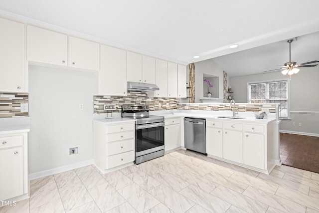 kitchen featuring sink, white cabinetry, appliances with stainless steel finishes, and lofted ceiling