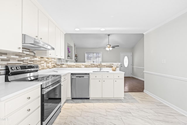 kitchen featuring stainless steel appliances, white cabinetry, and sink