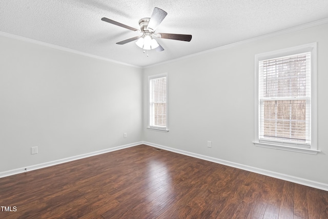 spare room featuring ceiling fan, a textured ceiling, dark hardwood / wood-style flooring, and ornamental molding