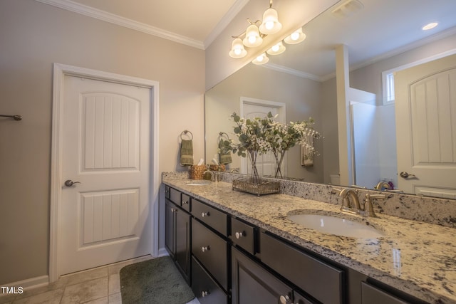 bathroom with vanity, ornamental molding, tile patterned floors, and walk in shower