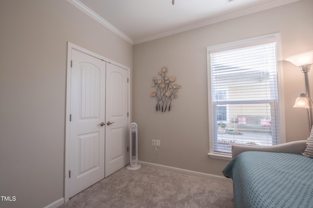 bedroom with crown molding, light carpet, and a closet