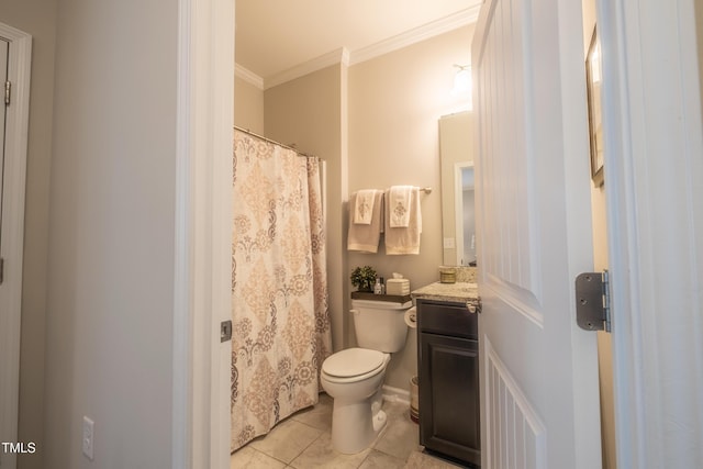 bathroom with tile patterned flooring, ornamental molding, vanity, and toilet